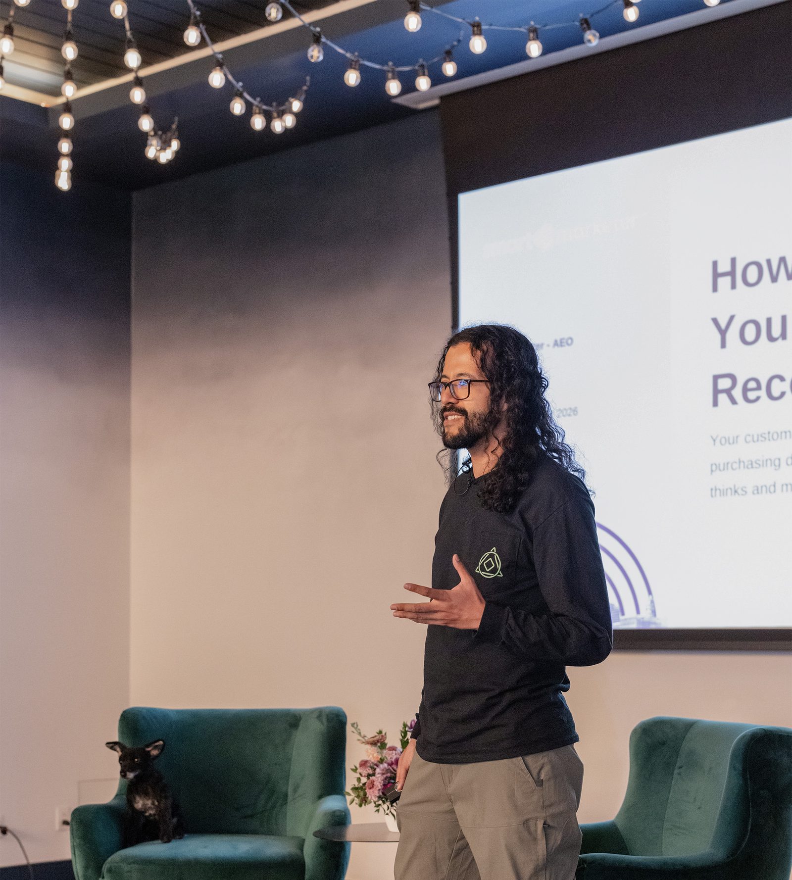 Julian Lopez delivering an Answer Engine Optimization talk on stage at the Mentor Table Conference in Nashville.