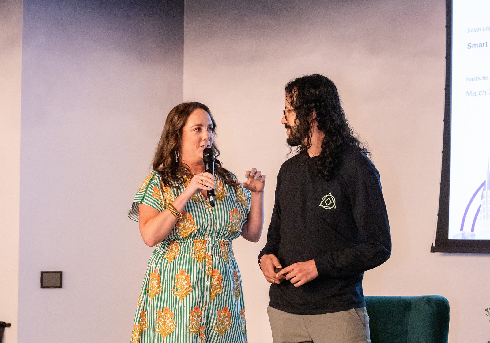 Julian Lopez being introduced on stage before his AEO keynote at the Mentor Table Conference.